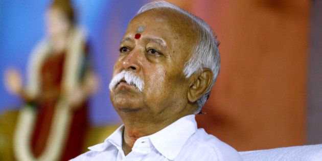 Hindu nationalist Rashtriya Swayamsevak Sangh (RSS), or the National Volunteers Force chief Mohan Bhagwat attends a meeting of their organization in Bangalore, India, Friday, March 7, 2014. The three day annual top level meeting of RSS, the parent organization of India's main political opposition Bharatiya Janta Party (BJP) started Friday. (AP Photo/Aijaz Rahi)