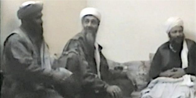 In this undated photo provided by the United States Attorneyâs Office for the Southern District of New York, defendant Suliman Abu Ghayth, left, joins al-Qaida founder Osama Bin Laden, center, and an unidentified man somewhere in Afghanistan. Abu Ghayth, Osama Bin Ladenâs son-in-law, is being tried in New York for his role as a recruiter and motivational speaker for the terror group. (AP Photo/US Attorneyâs Office for the Southern District of New York)