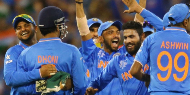 MELBOURNE, AUSTRALIA - FEBRUARY 22: MS Dhoni of India celebrates with his teammates after running out...