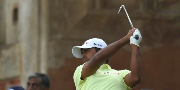 Indian golfer Anirban Lahiri plays a shot during the Indian Open golf tournament in New Delhi on February 22, 2015. AFP PHOTO/ MONEY SHARMA (Photo credit should read MONEY SHARMA/AFP/Getty Images)