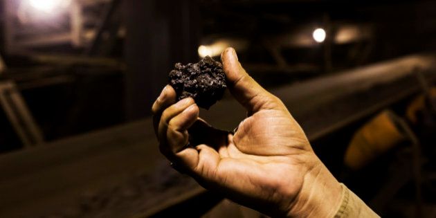A worker holds a lump of sinter for a photograph in the sintering unit of the Jindal Steel & Power Ltd. plant in Raigarh, Chhattisgargh, India, on Monday, Feb. 9, 2015. Jindal Steel manufactures sponge iron, mild steel, and cement. The Company also produces power, conducts mining operations for iron ore and coal, and explores for natural gas and oil. Photographer: Udit Kulshrestha/Bloomberg via Getty Images