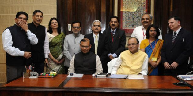 NEW DELHI, INDIA - FEBRUARY 27: Union Finance Minister Arun Jaitley with MoS for Finance Jayant Sinha and his team of officials giving final touch to the General budget 2015-16 on February 27, 2015 in New Delhi, India. Finance Minister Arun Jaitley will present tomorrow the first full year Budget of the NDA government, hyped as a 'make or break' exercise, that is widely expected to unveil sops for tax payers while pushing forward the 'Make In India' campaign. (Photo by Mohd Zakir/Hindustan Times via Getty Images)