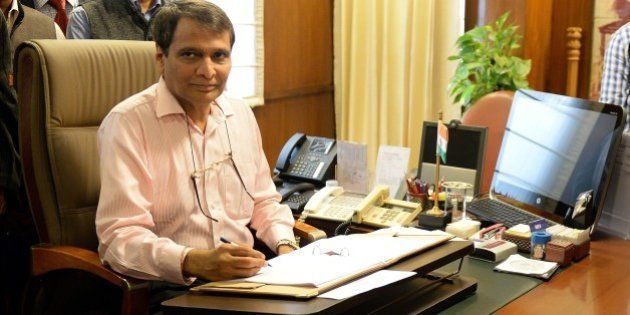 Indian Railway Minister Suresh Prabhu poses for the media while giving the final touches to the Railway Budget in New Delhi on February 25, 2015. Union Railway Minister will table the railway budget in parliament on 26 February. AFP PHOTO / PRAKASH SINGH (Photo credit should read PRAKASH SINGH/AFP/Getty Images)