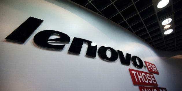 The Lenovo Group Ltd. logo is displayed in the company's headquarters in Beijing, China, on Tuesday, Nov. 11, 2014. Lenovo Chief Executive Officer Yang Yuanqing has expanded in computer servers and mobile phones, including the $2.91 billion purchase of Motorola Mobility, to help combat a shrinking personal-computer market. Photographer: Tomohiro Ohsumi/Bloomberg via Getty Images