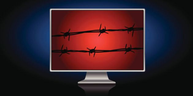 Computer screen with barbed wire on it.