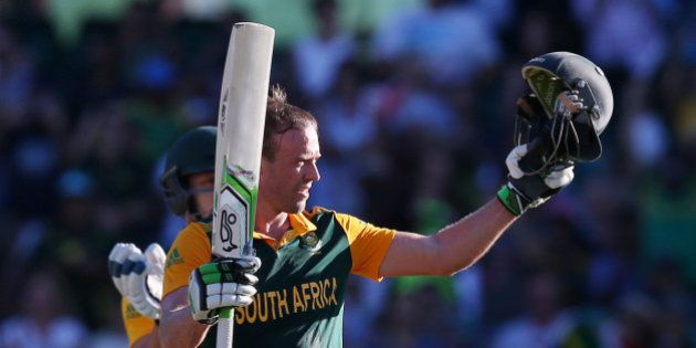 South Africa's AB De Villiers celebrates after scoring a 150 runs during their Cricket World Cup Pool B match against the West Indies in Sydney, Australia, Friday, Feb. 27, 2015. (AP Photo/Rick Rycroft)