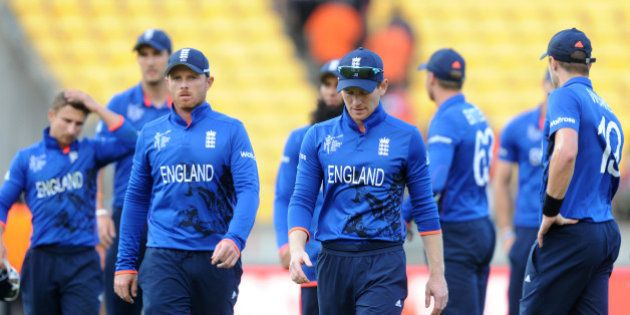 Englandâs captain Eoin Morgan leads his player's from the field after they lost to Sri Lanka by nine wickets during their Cricket World Cup match in Wellington, New Zealand, Sunday, March 1, 2015. (AP Photo Ross Setford)