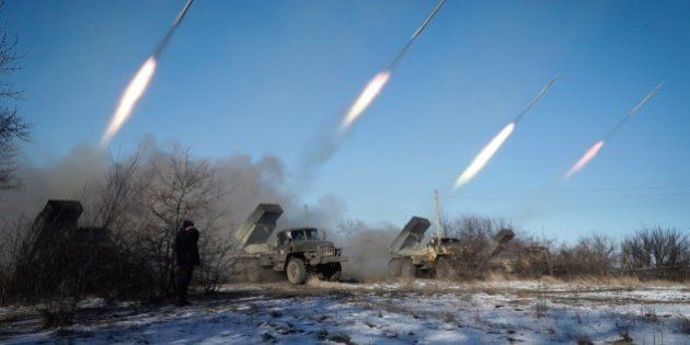 Pro-Russian rebels stationed in the eastern Ukrainian city of Gorlivka, Donetsk region, launch rockets from Grad launch vehicles on February 18, 2015. Ukrainian troops pulled out of the hotspot eastern town of Debaltseve after it was stormed by pro-Russian rebels in what the EU said was a 'clear violation' of an internationally-backed truce. AFP PHOTO / ANDREY BORODULIN (Photo credit should read ANDREY BORODULIN/AFP/Getty Images)