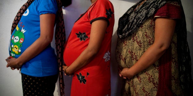 A MUMBAI GHETTO, MUMBAI, INDIA - 2012/11/07: A clinic in Mumbai called 'Surrogacy India' have rented a room in a ghetto for three surrogate mothers to carry the embryos for the clinic's clients; the three mothers don't recieve much help from the clinic and rely mostly on each other. Eggs from Europeans, semen from wealthy Westerners and embryos planted in desperate women's bodies. The Indian baby factories have become a growing multi-billion dollar industry.. (Photo by Jonas Gratzer/LightRocket via Getty Images)