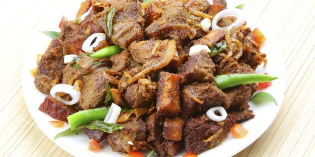 Indian meat fry served on plate.