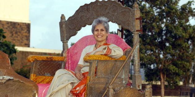 INDIA - AUGUST 30: Anu Aga, Chairman, Thermax, sits and poses on Horse Cart (Bagghi) at outdoor location, in Mumbai, India. Potrait, Sitting (Photo by Vivan Mehra/The India Today Group/Getty Images)