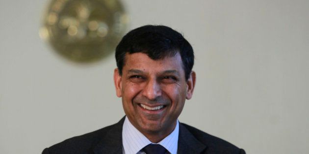 Reserve Bank of India (RBI) Governor Raghuram Rajan smiles after announcing the first bimonthly monetary policy statement at the RBI headquarters in Mumbai, India, Tuesday, April 1, 2014. Rajan announced Tuesday that the key policy rate will remain unchanged since retail inflation still remains