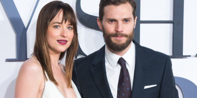 LONDON, ENGLAND - FEBRUARY 12: Jamie Dornan and Dakota Johnson attend the UK Premiere of 'Fifty Shades Of Grey' at Odeon Leicester Square on February 12, 2015 in London, England. (Photo by Samir Hussein/WireImage)