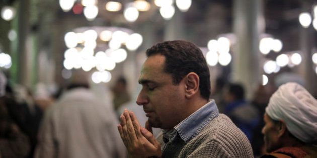 A man prays as Egyptian Muslims gather during Moulid al-Hussein, a religious celebration marking the birthday of the grandson of the Prophet Muhammad, in Cairo, Egypt, Tuesday, Feb. 17, 2015. The celebration is one of the largest in Egypt, which attracts hundreds of thousands of Muslims worshippers from all over the country and takes place at Al-Hussein mosque. (AP Photo/Mosa'ab Elshamy)