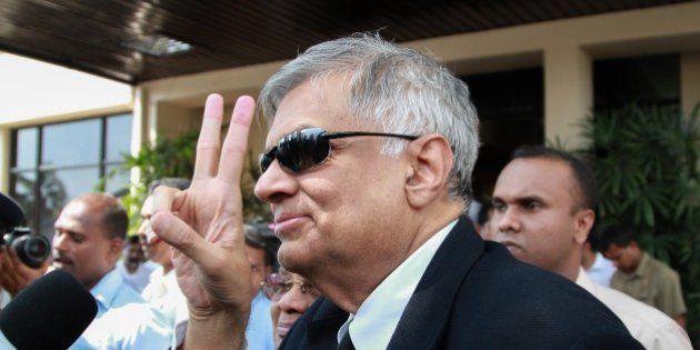 COLOMBO - SRI LANKA - JANUARY 09: Sri Lanka's newly elected Prime Minister Ranil Wickremasinghe flashes v-sign arrives at the election commission office in Colombo, Sri Lanka, on January 09, 2015. (Photo by Chamila Karunarathne/Anadolu Agency/Getty Images)