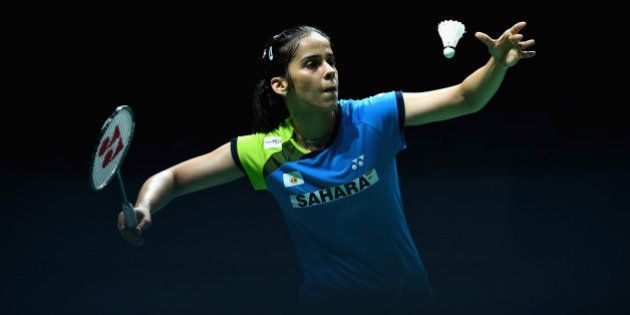 DUBAI, UNITED ARAB EMIRATES - DECEMBER 19: Saina Nehwal of India serves as she plays against Bae Yeon Ju of Korea in the Womens Singles during the BWF Destination Dubai World Superseries Finals day three at the Hamdan Sports Complex on December 19, 2014 in Dubai, United Arab Emirates. (Photo by Christopher Lee/Getty Images for Falcon)