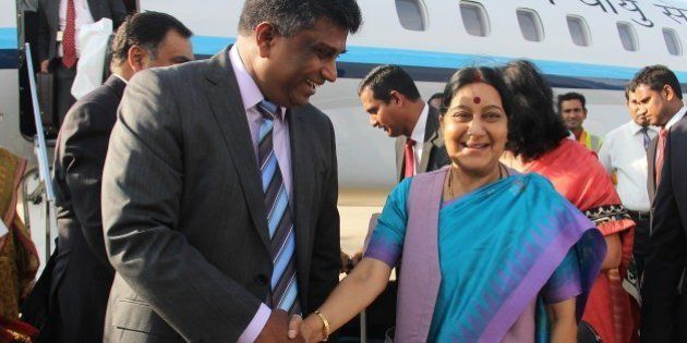 Indian Foreign Minister Sushma Swaraj (R) shakes hands with Sri Lankan Deputy Foreign Minister Ajith P. Perera (L) upon her arrival at the Bandaranaike International Airport in Katunayake on March 6, 2015. Swaraj is in Sri Lanka for talks ahead of Indian Prime Minister Narendra Modis visit from March 13-14. AFP PHOTO / ISHARA S. KODIKARA (Photo credit should read Ishara S.KODIKARA/AFP/Getty Images)