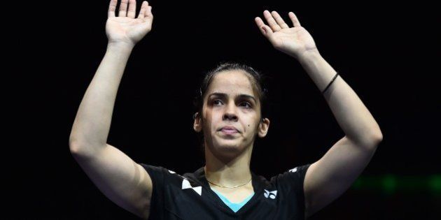 India's Saina Nehwal waves to the crowd after being defeated by Spain's Carolina Marin (not pictured) in their All England Open Badminton Championships women's singles final match in Birmingham, central England, on March 8, 2015. AFP PHOTO / BEN STANSALL (Photo credit should read BEN STANSALL/AFP/Getty Images)