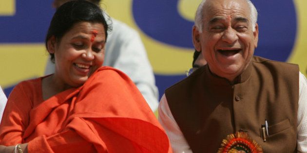 Uma Bharti, left, and Madan Lal Khurana share a light moment at a rally in New Delhi, India, Tuesday March 21, 2006. Uma Bharti declared her intentions of launching a new party while addressing her supporters at the rally. (AP Photo/Saurabh Das)