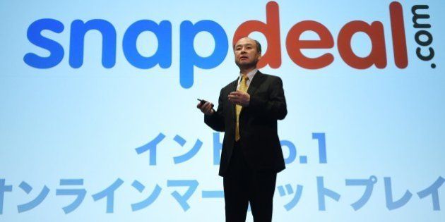 Chairman of Japanese mobile carrier SoftBank, Masayoshi Son, speaks about the company's investment over Indian leading online marketplace Snapdeal.com during a press conference in Tokyo on November 4, 2014. SoftBank said net profit in the first six months of its fiscal year jumped by more than a third, thanks to a five-billion-USD gain from its stake in Chinese e-commerce giant Alibaba. AFP PHOTO / TOSHIFUMI KITAMURA (Photo credit should read TOSHIFUMI KITAMURA/AFP/Getty Images)