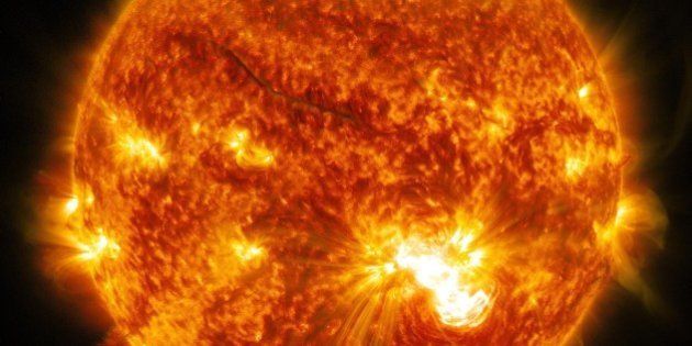 This image provided by NASA shows the sun emitting a significant X3.2-class flare erupting from the lower half of the sun, peaking at 5:40 p.m. EDT Friday Oct. 24, 2014. NASA's Solar Dynamics Observatory, which watches the sun constantly and captured images of the event. (AP Photo/NASA)