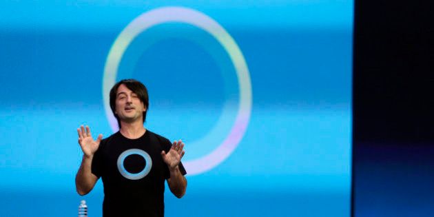 Microsoft corporate vice president Joe Belfiore, of the Operating Systems Group, gestures while demonstrating the new Cortana personal assistant during the keynote address of the Build Conference Wednesday, April 2, 2014, in San Francisco. Microsoft kicked off its annual conference for software developers, with new updates to the Windows 8 operating system and upcoming features for Windows Phone and Xbox. (AP Photo/Eric Risberg)