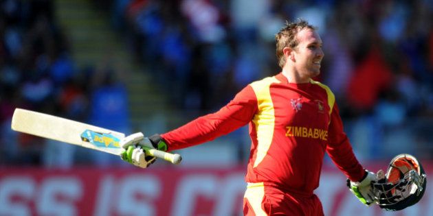 Zimbabwe's Brendan Taylor celebrates after scoring a century while batting against India during their Cricket World Cup Pool B match in Auckland, New Zealand, Saturday, March 14, 2015. (AP Photo/Ross Setford)
