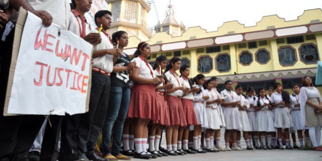 Students of Convent of Jesus and Mary School participate in a protest against the gang rape of a nun in her 70s by a group of bandits when she tried to prevent them from robbing the Christian missionary school in Begopara, about 80 kilometers (50 miles) northeast of Kolkata, the capital of West Bengal state, Saturday, March 14, 2015. The nun was hospitalized in serious condition after the attack, which was committed by seven or eight men. The woman who was attacked is either 71 or 72 and is the oldest nun at the school, a police officer said. (AP Photo/Pranab Debnath)