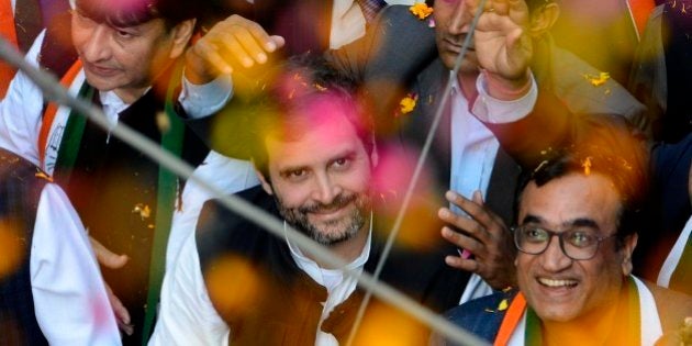 NEW DELHI,INDIA FEBRUARY 05: Congress Vice President Rahul Gandhi with congress candidate Ajay Maken waves at an election road show in New Delhi.(Photo by Shekhar Yadav/India Today Group/Getty Images)