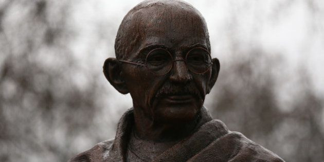 LONDON, ENGLAND - MARCH 16: A statue of Indian independence leader Mahatma Gandhi is pictured in Parliament Square on March 16, 2015 in London, England. The 2.7m bronze statue was unveiled in a ceremony at the weekend attended by Prime Minister David Cameron and marks 100 years since Gandhi returned to India from South Africa to start his struggle for independence from British colonial rule. (Photo by Carl Court/Getty Images)