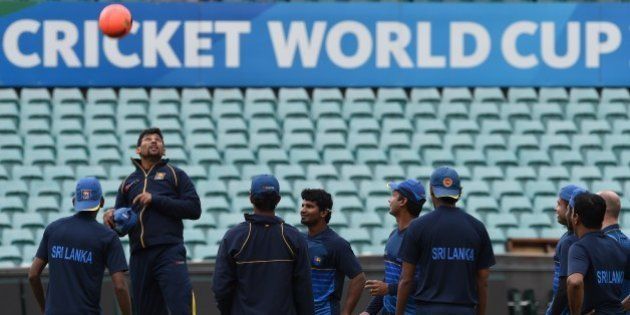 Sri Lankan cricketer Tillakaratne Dilshan (2nd L) jumps to head a ball as teammates look on at the Sydney Cricket Ground during a training session ahead of the 2015 Cricket World Cup first Quarter Final match between Sri Lanka and South Africa in Sydney on March 16, 2015. AFP PHOTO / INDRANIL MUKHERJEE -- IMAGE RESTRICTED TO EDITORIAL USE - STRICTLY NO COMMERCIAL USE-- (Photo credit should read INDRANIL MUKHERJEE/AFP/Getty Images)