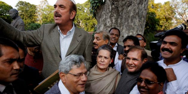 Congress party President Sonia Gandhi, center, Communist Party of India (Marxist) leader Sitaram Yechury, center left, Janata Dal (United) leader Sharad Yadav, center right, Congress party leader Ghulam Nabi Azad, top, and other lawmakers gather at parliament house to participate in a march against the ruling Bharatiya Janata Partyâs Land Acquisition Bill in New Delhi, India, Tuesday, March 17, 2015. Opposition lawmakers led by Gandhi marched from Parliament house to the Presidential Palace protesting against the bill that they termed as anti-farmer and pro-corporate, Press Trust of India reported. (AP Photo/Manish Swarup)