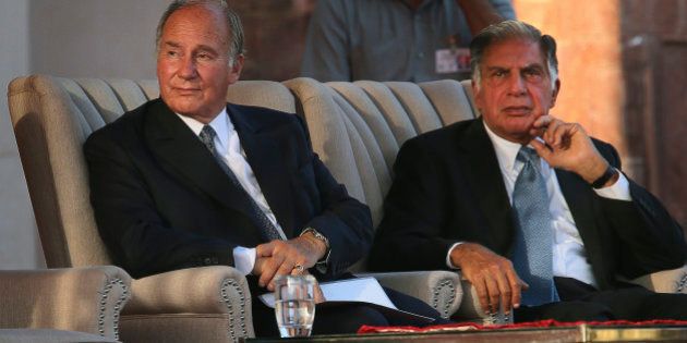 The Aga Khan, spiritual head of Ismaili Muslims, left, and Chairman of Sir Dorabji Tata Trust Ratan Tata listen to Indian Prime Minister Manmohan Singh during the inauguration of the restored 16th century Humayun's Tomb in New Delhi, India, Wednesday, Sept. 18, 2013. It took six years of conservation work and 200,000 work days by master craftsmen to restore the tomb's Mughal finery, according to a press release. (AP Photo/Manish Swarup)