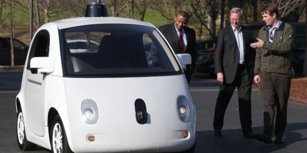 MOUNTAIN VIEW, CA - FEBRUARY 02: Google's Chris Urmson (R) shows a Google self-driving car to U.S. Transportation Secretary Anthony Foxx (L) and Google Chairman Eric Schmidt (C) at the Google headquarters on February 2, 2015 in Mountain View, California. U.S. Transportation Secretary Anthony Foxx joined Google Chairman Eric Schmidt for a fireside chat where he unveiled Beyond Traffic, a new analysis from the U.S. Department of Transportation that anticipates the trends and choices facing our transportation system over the next three decades. (Photo by Justin Sullivan/Getty Images)