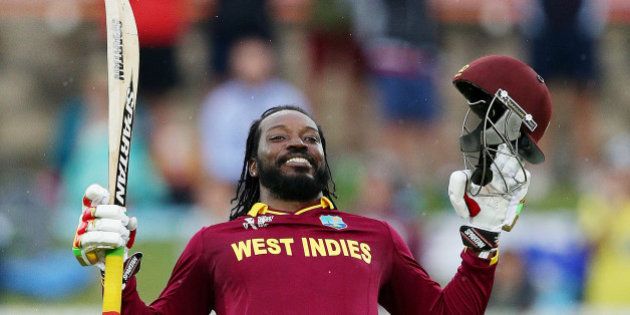 West Indies batsman Chris Gayle celebrates after scoring a double century during their Cricket World Cup Pool B match against Zimbabwe in Canberra, Australia, Tuesday, Feb. 24, 2015. (AP Photo/Rob Griffith)