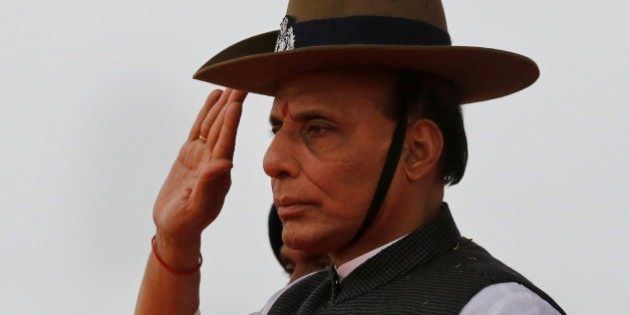 Indian Home Minister Rajnath Singh takes salute as he receives a guard of honor during a visit to a Rapid Action Force Camp in Allahabad, India, Wednesday, Jan.28, 2015. (AP Photo/ Rajesh Kumar Singh)
