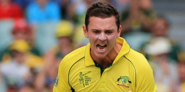 Australia's Josh Hazlewood celebrates after taking the wicket of Pakistan's Ahmad Shahzad during their Cricket World Cup quarterfinal match in Adelaide, Australia, Friday, March 20, 2015. (AP Photo/James Elsby)