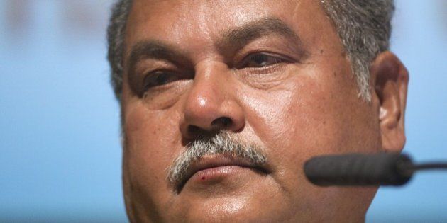 Narendra Singh Tomar, Indian Minister of Mines and Steel, speaks on the third day of Africa's biggest annual mining conference, the 'Mining Indaba', on February 11, 2015, at the International Convention Centre in Cape Town. Against a background of crashing commodity prices, mining in Africa is facing increasing pressure as governments and investors struggle over distribution of the mineral wealth lying under much of the continent. AFP PHOTO / RODGER BOSCH (Photo credit should read RODGER BOSCH/AFP/Getty Images)