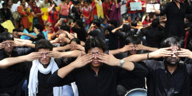 Protesters take part in a street play during a protest against growing cases of sexual abuse in New Delhi on May 5,2012. The protesters urged the police to take quick action over complaints of sexual abuse and stop making comments that suggest that women are to be blamed for acts of sexual abuse. AFP PHOTO/SAJJAD HUSSAIN (Photo credit should read SAJJAD HUSSAIN/AFP/GettyImages)