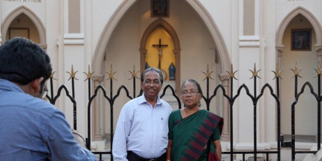 A christian couple poses for a photograph outside a church in Mumbai, India, Tuesday, March 17, 2015. India's Prime Minister Narendra Modi said Tuesday that he was