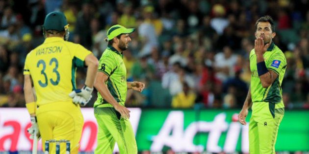 Pakistan's Wahab Riaz blows a kiss to Australia's Shane Watson, left, during their Cricket World Cup quarterfinal match in Adelaide, Australia, Friday, March 20, 2015. (AP Photo/James Elsby)