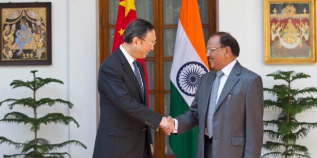 Indiaâs National Security Adviser Ajit Kumar Doval, right, and Chinese State Councilor Yang Jiechi shake hands before the start of the 18th round of talks on India-China border dispute in New Delhi, India, Monday, March 23, 2015. Yang is on a two-day visit to the country. (AP Photo/Manish Swarup)