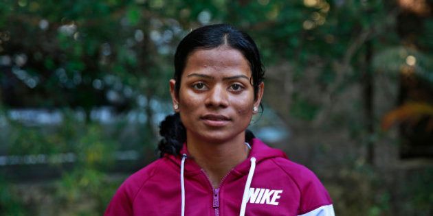 In this Wednesday, Oct. 29, 2014 photo, Indian athlete Dutee Chand poses for the camera in Mumbai, India. The 18-year-old has now decided to fight the ban for 'hyperandrogenism' or the presence of high levels of testosterone in the body that makes the sprinter ineligible to compete according to International Association of Athletics Federation rules. Chand won two gold medals at the Asian junior track and field championship. (AP Photo/Rafiq Maqbool)