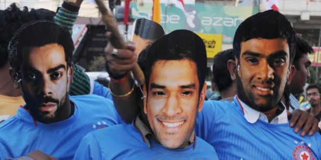 RANCHI, INDIA - MARCH 19: Cricket fans of the home town of team India Captain MS Dhoni celebrating the India team victory against Bangladesh in quarter final match of ongoing ICC Cricket World Cup 2015 tournament on March 19, 2015 in Ranchi, India. Dhoni guided his team into the semi-finals of this years World Cup with a 109-run romp over Bangladesh. With this win He became just the third captain, and the first Indian, to lead his country to 100 ODI wins, joining the Australian pair of Ricky Ponting and Allan Border. (Photo by Parwaz Khan/Hindustan Times via Getty Images)