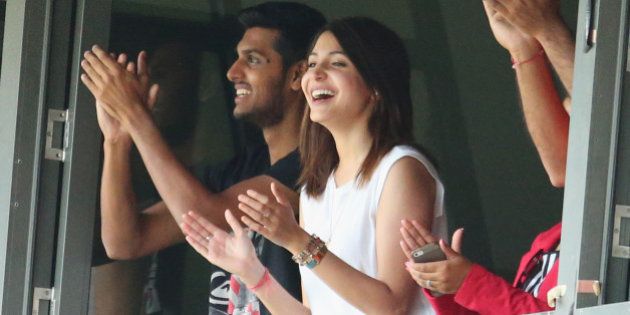 MELBOURNE, AUSTRALIA - DECEMBER 28: Anushka Sharma, girlfriend of Virat Kohli smiles as Kohli celebrates after reaching his century during day three of the Third Test match between Australia and India at Melbourne Cricket Ground on December 28, 2014 in Melbourne, Australia. (Photo by Scott Barbour/Getty Images)