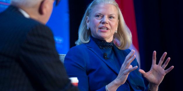 Virginia 'Ginni' Rometty, chief executive officer of International Business Machines Corp. (IBM), speaks to David Rubenstein, co-chief executive officer of Carlyle Group LP, left, during an Economic Club of Washington breakfast discussion in Washington, D.C., U.S., on Wednesday, Dec. 3, 2014. IBM, under pressure to reverse declining profit, is racing to sign up new cloud-related business as it tries to prove to investors that it can quickly transition to a new era of technology. Photographer: Andrew Harrer/Bloomberg via Getty Images