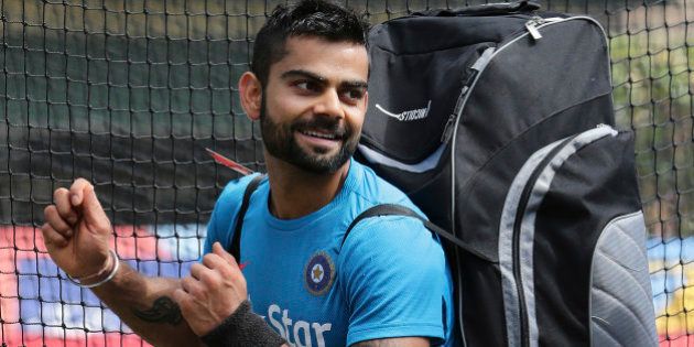 India's Virat Kohli enjoys a light moment after training for the Cricket World Cup in Sydney, Australia, Wednesday, March 25, 2015. India will play Australia in the World Cup semifinal on Thursday to gain a place in the final against New Zealand.(AP Photo/Rob Griffith)