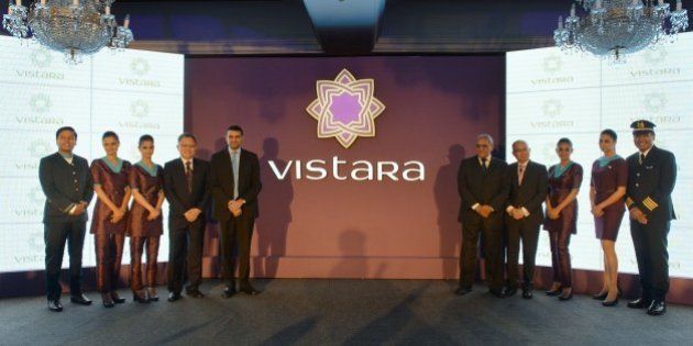 Staff members of TATA SIA Airlines Limited (TSAL) pose during the launch of the new brand name 'Vistara' - Sanskrit word denoting limitless expanse - for the new airline in New Delhi on August 11, 2014. Tata Group and Singapore Airlines, which partnered to launch a full-service airline in the country, plans to launch services in October 2014. AFP PHOTO/Chandan Khanna (Photo credit should read Chandan Khanna/AFP/Getty Images)