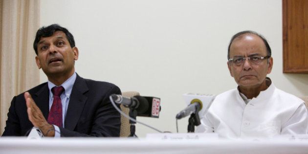 Raghuram Rajan, governor of the Reserve Bank of India (RBI), left, speaks as Arun Jaitley, India's finance minister, listens during a news conference at the central bank's headquarters in New Delhi, India, on Sunday, March 22, 2015. Jaitley said he discussed plans to combine India's stock and commodities market regulators in a meeting with the Securities and Exchange Board of India, according to comments made to reporters in New Delhi. Photographer: Kuni Takahashi/Bloomberg via Getty Images