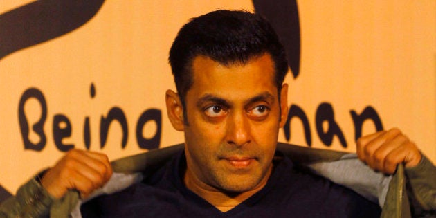 Bollywood star Salman Khan poses wearing a Being Human t-shirt during the launch of Being Human's first...